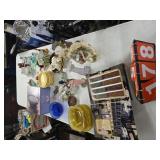 table of fiestaware, carnival glass figurines misc
