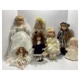 Seven Porcelain Dolls in Themed Outfits