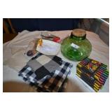 Green glass jar, paper products, curtains