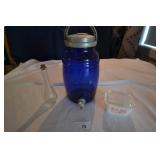 Blue glass pitcher, pink pyrex, glass bottle