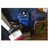 Suitcases, cooler, wastebasket