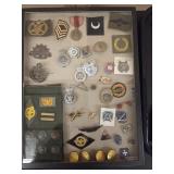 Military Pins, Patches and Medals in Display Case