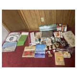 Box lot w/plastic table covers, books, buttons,