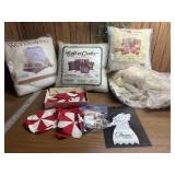 Startings of a quilt, pillows, a doll needs to be