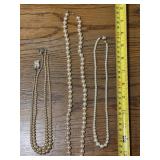 4 strands, look like pearls, 2 might be1 but broke