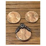 2 pennies marked VW & angel penny