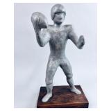 VINTAGE SCULPTURE OF A FOOTBALL PLAYER