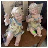 PAIR OF CERAMIC PIANO BABIES