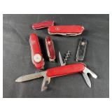 Collection of Swiss Army Knives, One Has Clock