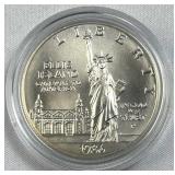 1986 Silver Uncirc. Ellis Island Dollar, US 90%