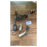 Black powder horn, cowbell, coonskin hat Black powder horn, cowbell, coonskin hat