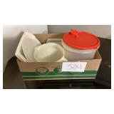 Tupperware containers, one larger container with Tupperware containers, one larger container with