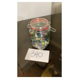 Glass jar full of vintage marbles Glass jar full of vintage marbles
