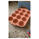 3 muffin tins, bowls, measuring cups, lighters 3 muffin tins, bowls, measuring cups, lighters