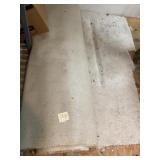 Large Roll of Light-Colored Carpet