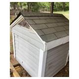 Small Outdoor Shed With Shingled Roof