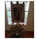 Angel wall hanging and a floral centerpiece