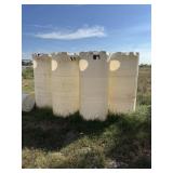 Four polyethylene cylindrical storage tanks