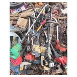 Lot of miscellaneous weed eaters and parts.