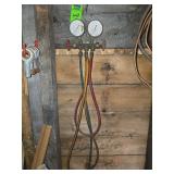 vintage analog HVAC manifold gauge set used for testing and charging refrigeration systems.