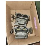 carburetors for Johnson or Evinrude outboard boat motors, likely from a V4 or V6 engine configuration