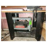 Delta 12-inch portable thickness planer, commonly model 22-540, designed for reducing the thickness of wood boards
