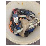 Bucket of miscellaneous ratchet straps