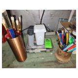 Paint brushes, pencils, markers