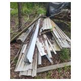 Assorted siding pieces and wood