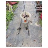 2 old fishing poles and bucket of miscellaneous fishing lines