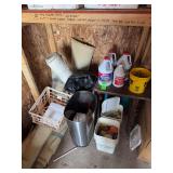 Corner Contents (Trash can, outdoor cleaner, wooden table, painted rocks, clothes pins, carpet remnants)