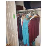 Left side of closet, women's clothing size medium, shoes size 8, luggage laundry basket