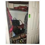 Contents of closet. Women's shoes size 8-8.5. women's clothing size med/large, purses. Laundry basket of shoes and sandals