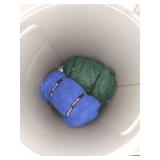 Trash can with various camping gear