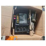 The Eagle Mach 1 Computer Graph by Lowrance is a vintage, paper-chart sonar fish finder from the late 1980s that prints real-time depth and bottom contours onto moving thermal or pressure-sensitive gr