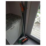 Various brooms amd dustpan