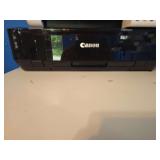Cannon printer with various printing papers, replacement toner cart, and ink