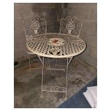 Wrought iron patio table and 2 matching chairs