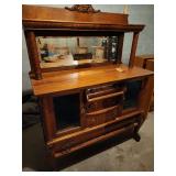 Antique Empire Quarter-Sawn Tiger Oak Sideboard / Buffet with a mirrored topper, likely from the early 1900s.