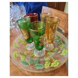 Vintage clear glass decorative platter featuring a hand-painted holly leaf and berry pattern