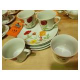 Vintage Seymour Mann Flower Garden porcelain china set decorated with vibrant red roses and yellow floral motifs.