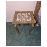 vintage Italian Florentine accent table featuring ornate gold-gilt filigree scrollwork on a textured off-white center and curved cabriole legs