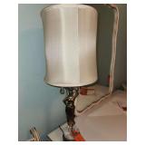 Neoclassical-style figural table lamp featuring a bronze-toned classical female figure, a marble and crystal base, and hanging crystal prisms below an off-white fabric drum shade