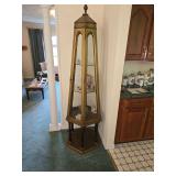 vintage six-sided obelisk curio cabinet featuring an antiqued gold finish and glass display panels. NO CONTENTS