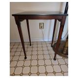 traditional mahogany wood accent or nesting table featuring slender, tapered legs with distinctive spoon feet