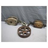 Two small Antique Pullys w/ Cast Iron Wheel