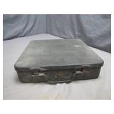 A Weathered Black Metal Briefcase