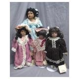 Four Porcelain Dolls with Outfits