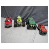 Four Toy Monster and Pickup Trucks
