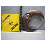 Decorative Moon Sculpture and Mosquito Sign